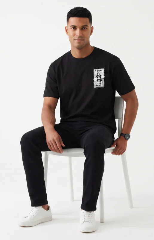 Zulqifl Black Oversized T-Shirt Front View sitting