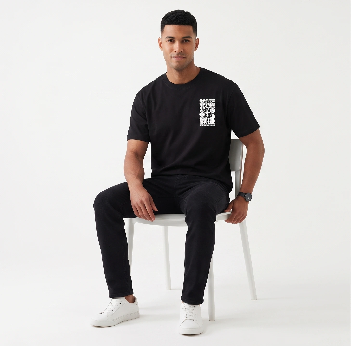 Zulqifl Black Oversized T-Shirt Front View sitting